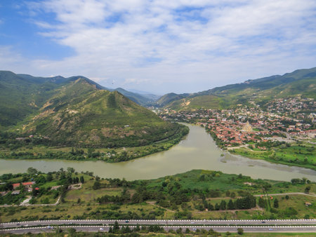 Scenic aerial view of Mtskheta town, the confluence of Aragvi and Kura rivers, seen from Jvari Monastery, Georgiaの写真素材