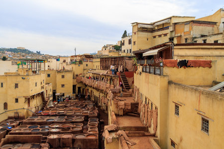 Old tanks of the Fez's tanneries with color paint for leather, Morocco, Africa. The Fez dye works. Leather dressing according to ancient technologies.の写真素材