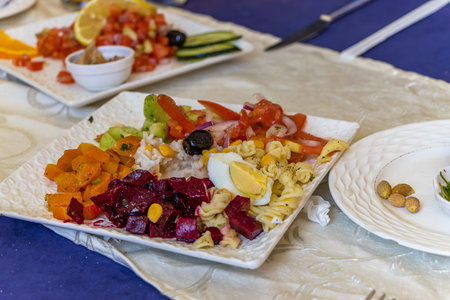 Carrot nuts dated Moroccan salad in a bowl. toningの写真素材