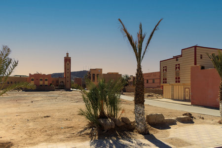 Esplanade and view of minarets of mosques in the background in Erfoud, Morocco
