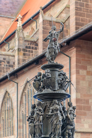 Nuremberg, Germany. The Nuremberg Virtue Fountain (Tugendbrunnen) with female allegories of the three divine virtues and the cardinal virtues of Platoの写真素材