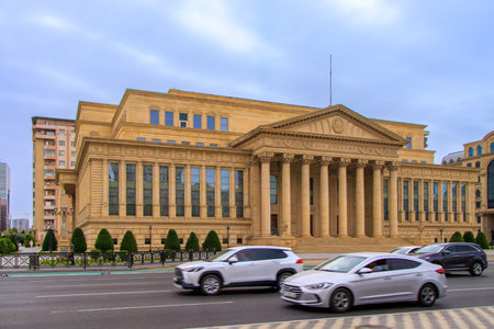 Baku, Azerbaijan. Building housing the Constitutional Court of the Republic of Azerbaijan. Exterior view in summer.This monumental building in the classical style features a majestic portico and columns worthy of the ancient Roman forum.の写真素材