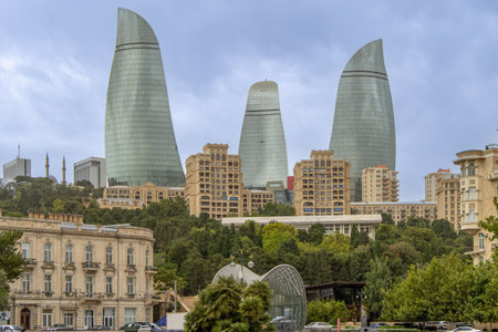 Baku, Azerbaijan. The iconic Flame Towers, stand tall against a vibrant sunset sky. These modern skyscrapers are a symbol of the city's dynamic growth and futuristic vision.の写真素材