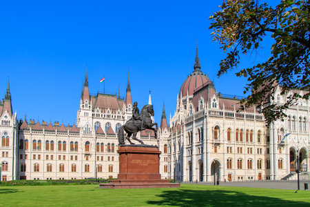 Budapest, Hungary. Hungarian Parliament in Budapest with Ferenc Rakoczi II statue on a sunny day.の写真素材
