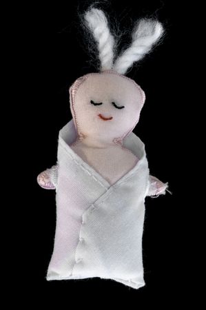 A figure placed in a crib at Christmas, the festival at which Christians celebrate the birth of , who they believe is the Christ, the saviour of the world.の写真素材