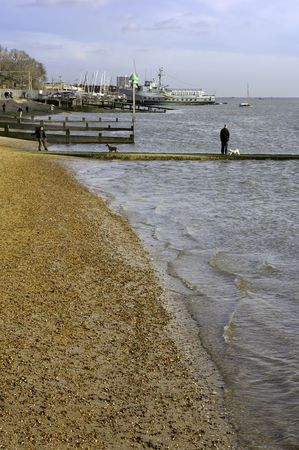 stroll along the water's edgeの写真素材