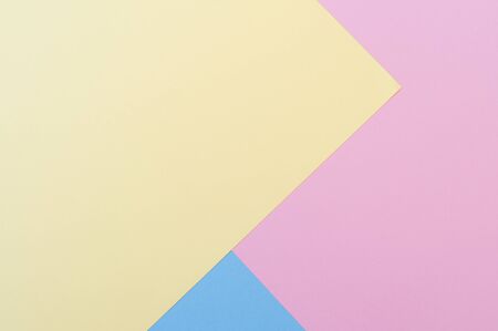 Yellow, blue and pastel pink background. Pink and yellow predominate in the image. Backgrounds, textures.の写真素材