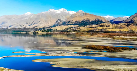 Landscape of New Zealand alps and lake with reflection in waterの写真素材