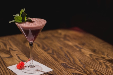 Classy cocktail, with mint and cherries on the napkinの写真素材