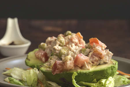 Avocado stuffed with tuna salad.の写真素材
