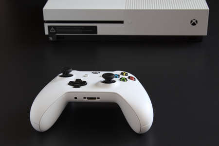 MEXICO CITY, MEXICO - MARCH 18 2021: Console and game controller of a white Xbox One.のeditorial素材