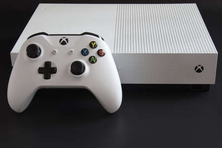 MEXICO CITY, MEXICO - MARCH 18 2021: Console and game controller of a white Xbox One.のeditorial素材
