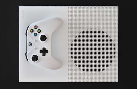 MEXICO CITY, MEXICO - MARCH 18 2021: Console and game controller of a white Xbox One.のeditorial素材