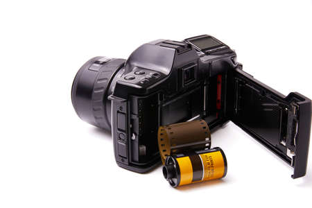 Analog black camera with 35mm photo reelの写真素材