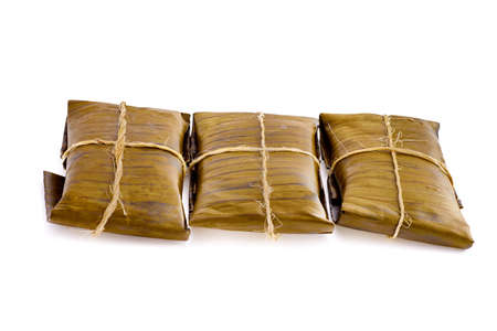 Typical Mexican food, Veracruz or jarochos tamales, prepared with banana leaves, corn flour and red adobo. Prehispanic food, that is, food prepared since before the arrival of the Spanish to Americaの写真素材