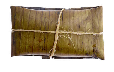 Typical Mexican food, Veracruz or jarochos tamales, prepared with banana leaves, corn flour and red adobo. Prehispanic food, that is, food prepared since before the arrival of the Spanish to Americaの写真素材