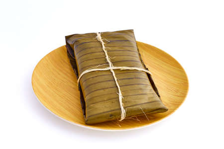 Typical Mexican food, Veracruz or jarochos tamales, prepared with banana leaves, corn flour and red adobo. Prehispanic food, that is, food prepared since before the arrival of the Spanish to Americaの写真素材