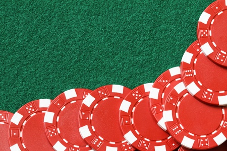 red poker chips on a table 
