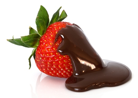 strawberry in chocolate over white backgroundの写真素材