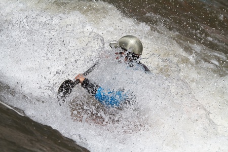 man in kayak, freestyle competition 