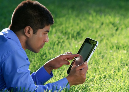 businessman at the park with tablet の写真素材