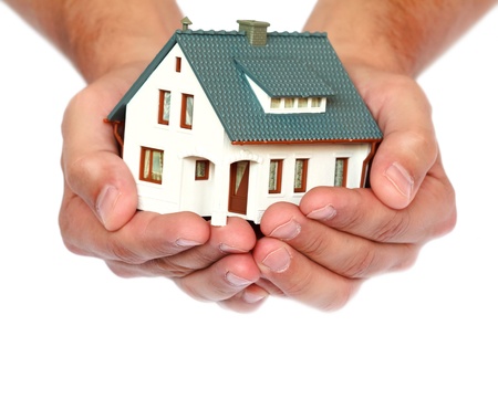 miniature house in hands の写真素材