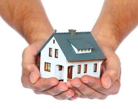 miniature house in hands の写真素材