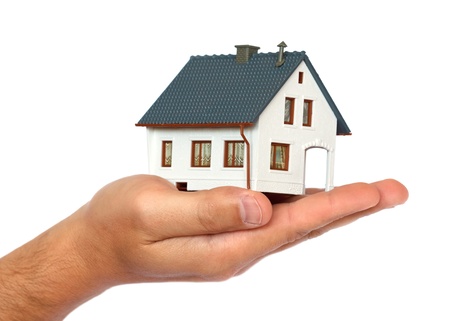 miniature house on hand の写真素材