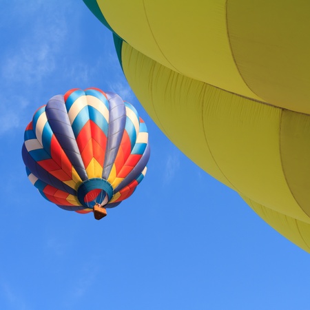 hot air balloons over blue skyの写真素材