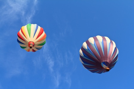 hot air balloons over blue skyの写真素材