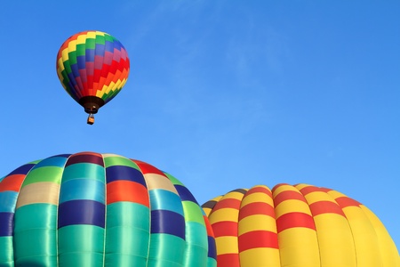 hot air balloons over blue skyの写真素材