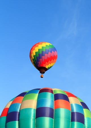 hot air balloons over blue skyの写真素材