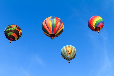 hot air balloons over blue skyの写真素材