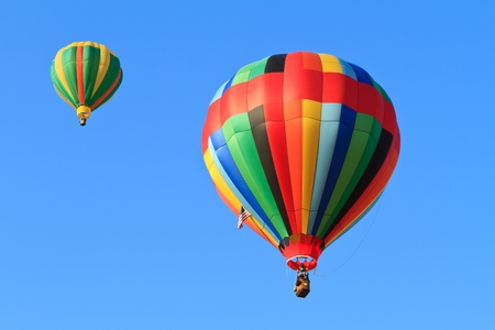 hot air balloons over blue skyの写真素材
