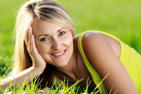 happy young attractive woman outdoors の写真素材