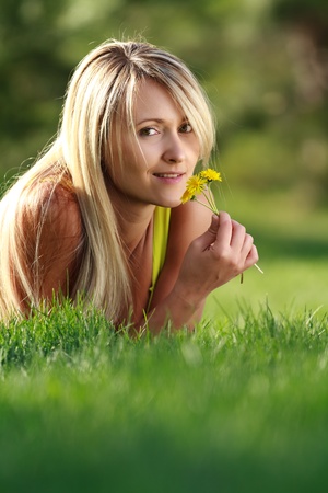 young attractive woman with flowersの写真素材