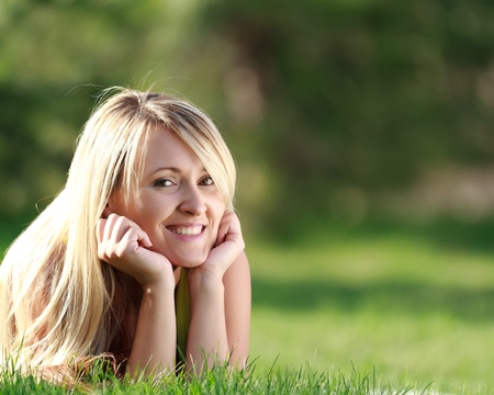 happy young attractive woman outdoorsの写真素材