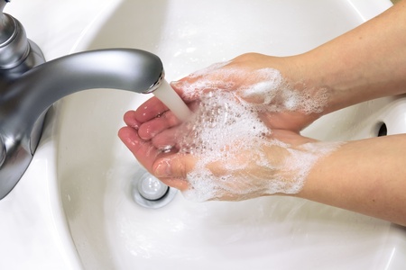 cleaning hands with soap の写真素材