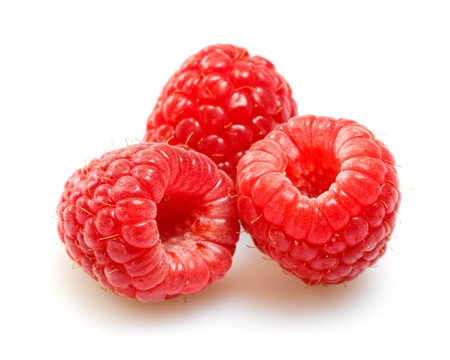 raspberries over white background