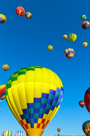 hot air balloons over blue skyの写真素材