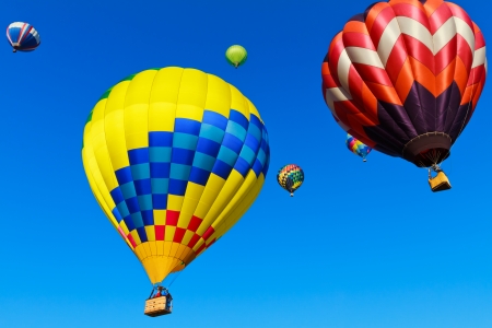 hot air balloons over blue skyの写真素材