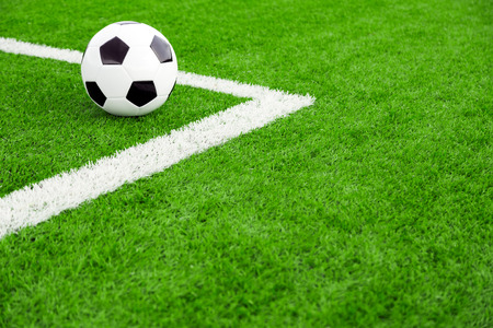 Traditional soccer ball on soccer fieldの写真素材