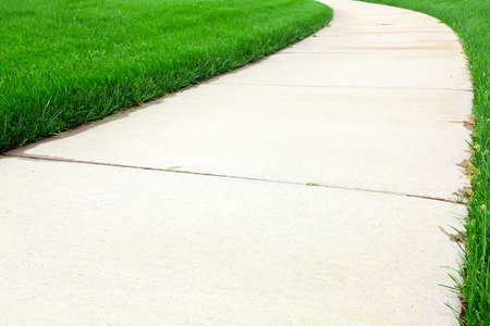 Pathway through green lawnの写真素材