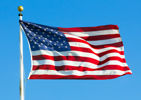 American flag against clear blue sky