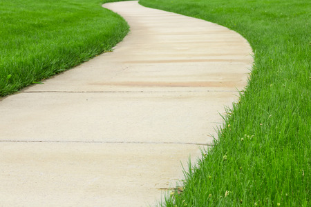 Pathway through green lawnの写真素材