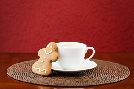 Gingerbread cookie with cup of coffeeの写真素材