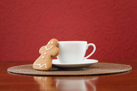 Gingerbread cookie with cup of coffeeの写真素材
