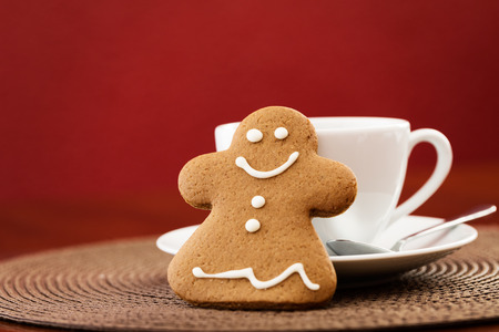 Gingerbread cookie with cup of coffeeの写真素材