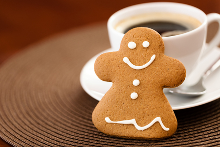 Gingerbread cookie with cup of coffeeの写真素材