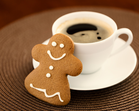 Gingerbread cookie with cup of coffeeの写真素材